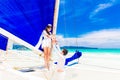 Young beautiful couple having fun on a tropical beach . Tropical Royalty Free Stock Photo