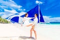 Young beautiful couple having fun on a tropical beach . Tropical Royalty Free Stock Photo