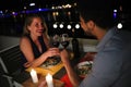 Young beautiful couple having romantic dinner on rooftop Royalty Free Stock Photo