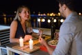 Young beautiful couple having romantic dinner on rooftop Royalty Free Stock Photo