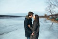 Young beautiful couple on the ice of a frozen lake Royalty Free Stock Photo