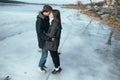 Young beautiful couple on the ice of a frozen lake Royalty Free Stock Photo