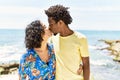 Young beautiful couple kissing and hugging standing at the beach Royalty Free Stock Photo