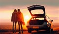 Young beautiful couple kissing sunset their car open luggage compartment Travel adventure lifestyle trip vacation concept journey Royalty Free Stock Photo