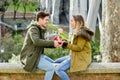 Young beautiful couple in love celebrating Valentines day presents and rose Royalty Free Stock Photo