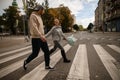 Young beautiful couple in love cross the road and look at each other Royalty Free Stock Photo