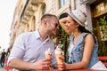 Young beautiful couple in love eating ice cream