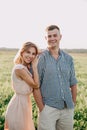 Young beautiful couple in love outdoor. Stunning sensual portrait of young couple posing in summer in field Royalty Free Stock Photo