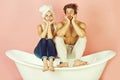 Young beautiful couple in love sitting on bath Royalty Free Stock Photo