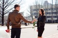 Young beautiful couple resting, walking in park, smiling, rejoicing. Outdoors Royalty Free Stock Photo