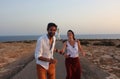 Young beautiful couple`s portrait with Cap de Barberia`s lighthouse on soft background, Formentera, Balearic Islands, Spain Royalty Free Stock Photo