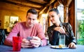 Young beautiful couple sitting in a bar or club Royalty Free Stock Photo