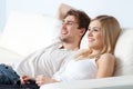 Young beautiful couple on a sofa at home Royalty Free Stock Photo