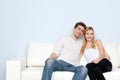 Young beautiful couple on a sofa at home Royalty Free Stock Photo