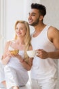 Young Beautiful Couple Stand Near Big Window, Drink Morning Coffee Cup, Happy Smile Hispanic Man Woman Royalty Free Stock Photo