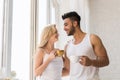 Young Beautiful Couple Stand Near Big Window, Drink Morning Coffee Cup, Happy Smile Hispanic Man Woman Royalty Free Stock Photo