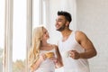 Young Beautiful Couple Stand Near Big Window, Drink Morning Coffee Cup, Happy Smile Hispanic Man Woman Royalty Free Stock Photo