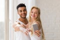 Young Beautiful Couple Stand Window, Taking Selfie Photo On Cell Smart Phone