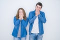 Young beautiful couple standing together over white isolated background shocked covering mouth with hands for mistake Royalty Free Stock Photo