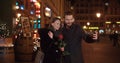 Young beautiful couple taking selfie in a city at night. Royalty Free Stock Photo