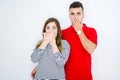 Young beautiful couple together over white isolated background shocked covering mouth with hands for mistake Royalty Free Stock Photo