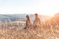 Young beautiful couple walking outside on beautiful sunset. Royalty Free Stock Photo