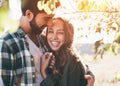 Young beautiful couple walking outside on beautiful sunset. Royalty Free Stock Photo