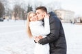 Young beautiful couple in the winter cold day walking in the cit Royalty Free Stock Photo