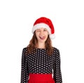 Young beautiful crazy woman in dress portrait. emotional girl in santa claus christmas hat isolated on white background. holiday c Royalty Free Stock Photo