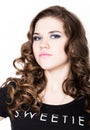 Young beautiful curly girl with professional make-up Royalty Free Stock Photo