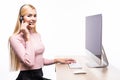 Young beautiful customer service operator girl in headset ,sitting at the desk isolated on white background. Royalty Free Stock Photo