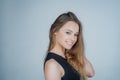 Young beautiful cute cheerful girl smiling looking at camera over white background. Portrait of happy young girl looking Royalty Free Stock Photo