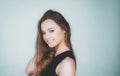 Young beautiful cute cheerful girl smiling looking at camera over white background. Portrait of happy young girl looking Royalty Free Stock Photo