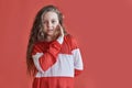 Young beautiful cute girl dancing on red background, modern slim hip-hop style teenage girl jumping Royalty Free Stock Photo