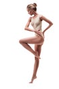 Young beautiful dancer in beige swimsuit