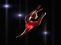 Young beautiful dancer gymnastics jumping in studio Royalty Free Stock Photo