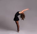 Young beautiful dancer gymnastics posing in studio