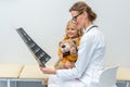 young beautiful doctor showing x-ray scans to Royalty Free Stock Photo
