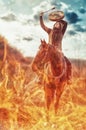 Young beautiful dreadded girl outdoors with her true horse. Fire background.