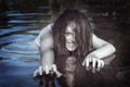 Young beautiful drowned ghost woman in the water Royalty Free Stock Photo