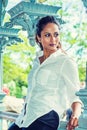 Young Beautiful East Indian American Woman relaxing, thinking outdoor in New York