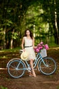 Young beautiful, elegantly dressed woman with retro bicycle. Healthy, cycling. Royalty Free Stock Photo