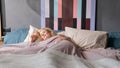 Young beautiful European woman sleeping in her bed and relaxing in the morning Royalty Free Stock Photo