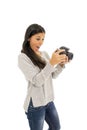 Young beautiful exotic hispanic photographer woman smiling happy looking reflex camera Royalty Free Stock Photo