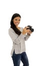 Young beautiful exotic hispanic photographer woman smiling happy looking reflex camera Royalty Free Stock Photo