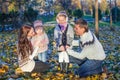 Young beautiful family of four enjoyed relaxing in Royalty Free Stock Photo
