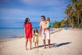 Young beautiful family of four enjoyed relaxing on Royalty Free Stock Photo