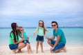 Young beautiful family of four enjoyed relaxing on Royalty Free Stock Photo