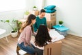 Mom, dad and girl looking at the house construction plans Royalty Free Stock Photo