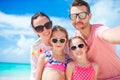 Young beautiful family taking selfie on the beach Royalty Free Stock Photo